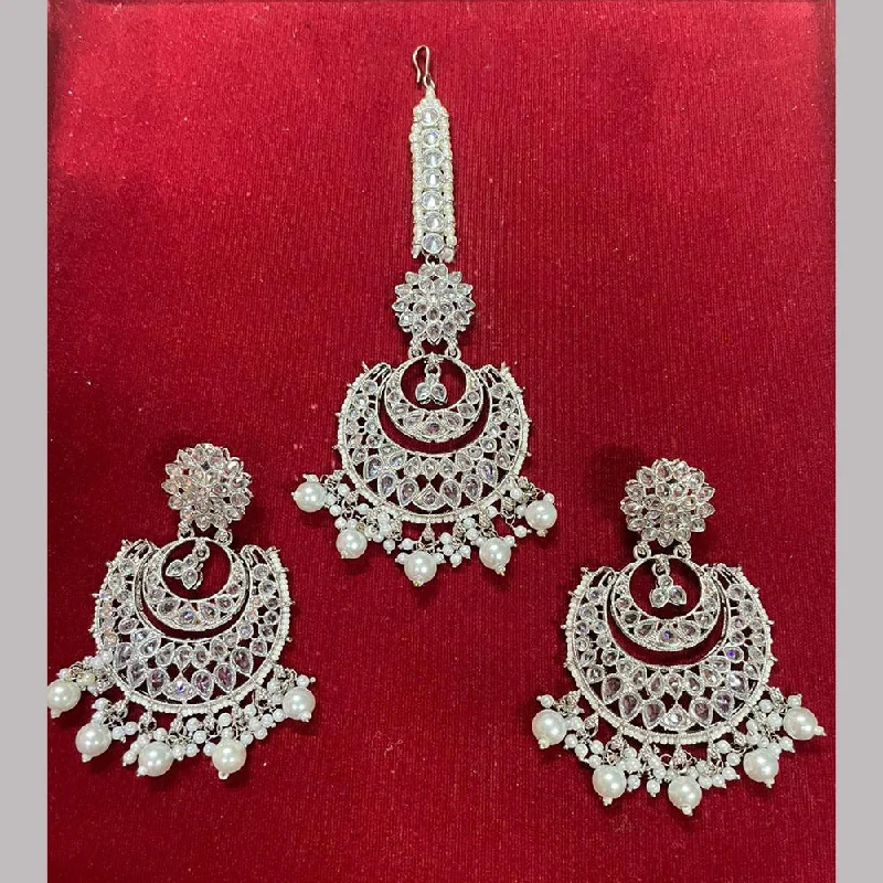 women textured earrings -Shree Chamunda Jewellers Silver Plated Pearl And Crystal Stone Earrings With Mangtikka