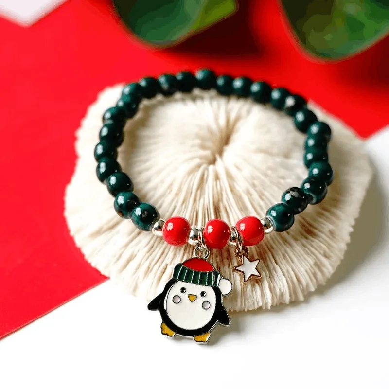 women braided bracelets -Children's 'Christmas Penguin' Stretch Bead Bracelet