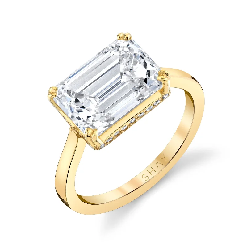 women gemstone rings -DIAMOND HIDDEN HALO EMERALD CUT EAST/WEST RING